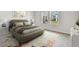 Cozy bedroom showcasing a plush bed, neutral decor, and plenty of natural light from the windows at 5938 Bristle Oak St, Mount Dora, FL 32757
