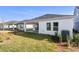 Newly constructed home showcasing a covered patio, and well-manicured lawn at 5938 Bristle Oak St, Mount Dora, FL 32757