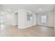 Open concept living area with hardwood floors at 5938 Bristle Oak St, Mount Dora, FL 32757