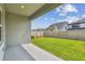 Beautiful backyard featuring green grass, a privacy fence, and a covered patio for outdoor living at 6063 Sacred Oak Ave, Mount Dora, FL 32757