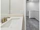 Bright bathroom featuring a modern sink, contemporary fixtures, and a stylish quartz countertop at 6063 Sacred Oak Ave, Mount Dora, FL 32757