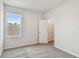Bedroom featuring carpeted floors, a window, and an open door to a walk-in closet at 6063 Sacred Oak Ave, Mount Dora, FL 32757