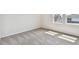 Bedroom with carpeted floors and two windows allowing ample natural light at 6063 Sacred Oak Ave, Mount Dora, FL 32757
