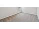 Comfortable bedroom showcasing plush carpeting and serene, neutral color palette at 6063 Sacred Oak Ave, Mount Dora, FL 32757
