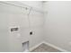 Practical laundry room with tiled floors, organized shelving, and utility connections for convenience at 6063 Sacred Oak Ave, Mount Dora, FL 32757