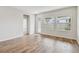 Living room with wood floors, a glass door, and lots of sunlight at 6063 Sacred Oak Ave, Mount Dora, FL 32757