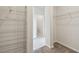 Walk-in closet showing wire racks and shelves and a view into the ensuite bath at 6063 Sacred Oak Ave, Mount Dora, FL 32757