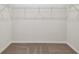 Empty walk-in closet showing carpeted floor and wire shelving at 6063 Sacred Oak Ave, Mount Dora, FL 32757
