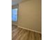 Bedroom with vinyl plank flooring and a large window at 9114 Sw 65Th Loop, Ocala, FL 34481