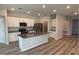 Modern kitchen with a large island, stainless steel appliances, and white cabinets at 9114 Sw 65Th Loop, Ocala, FL 34481