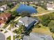 Two-story house situated on a corner lot near a lake at 13438 Davenham Pt, Orlando, FL 32832