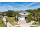 Two-story house with gray exterior, landscaping, and a pond nearby at 13438 Davenham Pt, Orlando, FL 32832