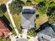 Top-down view of a two-story house with a pool and fenced enclosure at 13438 Davenham Pt, Orlando, FL 32832