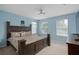 Spacious bedroom with a king-size bed and large windows at 13438 Davenham Pt, Orlando, FL 32832