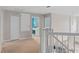 Upstairs hallway with carpet and access to multiple rooms at 13438 Davenham Pt, Orlando, FL 32832