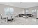 Spacious living and dining area with marble floors and modern furniture at 13438 Davenham Pt, Orlando, FL 32832