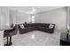Spacious living area with sectional sofa, tile floors and large TV at 13438 Davenham Pt, Orlando, FL 32832