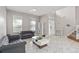 Living room with gray sofas, marble floors and a view of the entryway at 13438 Davenham Pt, Orlando, FL 32832