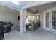 Relaxing outdoor patio with seating area, fire pit, and grill at 13438 Davenham Pt, Orlando, FL 32832
