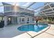 Spacious pool area with screened enclosure and patio at 13438 Davenham Pt, Orlando, FL 32832
