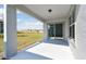 Covered patio with sliding glass doors and backyard view at 486 Pine Tree Blvd, Lake Alfred, FL 33850