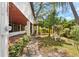 View of the beautiful backyard featuring stone pathway and white pergola at 3203 S Polk Ave, Lakeland, FL 33803