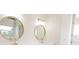 Bright bathroom featuring double vanity with modern gold fixtures and white cabinets at 3203 S Polk Ave, Lakeland, FL 33803
