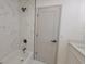 Bathroom with marble tiled shower, new fixtures, and an open, bright design at 3203 S Polk Ave, Lakeland, FL 33803