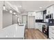 Spacious kitchen with stainless appliances, center island, and modern lighting at 3203 S Polk Ave, Lakeland, FL 33803
