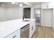 Kitchen features an island with a stainless steel sink and modern appliances at 3203 S Polk Ave, Lakeland, FL 33803