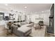 Bright open-concept living room featuring a fireplace, modern furnishings and decor, and an eat-in kitchen at 3203 S Polk Ave, Lakeland, FL 33803