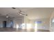 Open living space with an arched entryway, two ceiling fans, and natural light at 3203 S Polk Ave, Lakeland, FL 33803