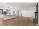 Spacious living room features a fireplace and flows into the modern kitchen at 3203 S Polk Ave, Lakeland, FL 33803