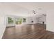 Spacious living room featuring wood floors, bright windows and slider to a deck at 3203 S Polk Ave, Lakeland, FL 33803