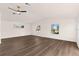 Inviting living room featuring modern ceiling fans, multiple windows, and neutral decor at 3203 S Polk Ave, Lakeland, FL 33803