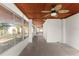 Enclosed outdoor space featuring many windows and a unique wood-look ceiling at 3203 S Polk Ave, Lakeland, FL 33803