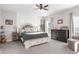 Bright bedroom with a shiplap wall, comfortable bed, and a sitting area near the window at 8631 Sw 70Th Ter, Bushnell, FL 33513