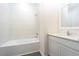 Stylish bathroom with a tub-shower combo and a modern vanity with a framed mirror at 13469 Leaping Water Way, Astatula, FL 34705