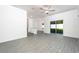 Large living room featuring gray floors, recessed lights and a ceiling fan at 13469 Leaping Water Way, Astatula, FL 34705