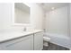 Bathroom with a combination tub and shower and a modern vanity sink at 13465 Leaping Water Way, Astatula, FL 34705