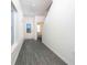 Welcoming foyer with hard surface flooring, natural light, and a view of the staircase and powder room at 13465 Leaping Water Way, Astatula, FL 34705