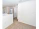 Upstairs hallway with neutral carpet and white walls, leading to various rooms at 13465 Leaping Water Way, Astatula, FL 34705