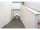 Inviting foyer with hard surface floors, a staircase, and views into the living area at 13466 Leaping Water Way, Astatula, FL 34705