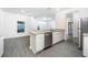 Modern kitchen island with a sink, granite countertops and stainless-steel dishwasher appliance at 13466 Leaping Water Way, Astatula, FL 34705