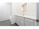 Clean bathroom with white cabinets, sink, and a walk-in shower and tub combo at 13473 Leaping Water Way, Astatula, FL 34705