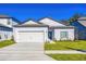 Charming single-Gathering home with a well-maintained lawn and a two-car garage at 13473 Leaping Water Way, Astatula, FL 34705