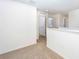 Hallway showcases neutral carpeting, white walls, and access to other rooms at 13485 Leaping Water Way, Astatula, FL 34705