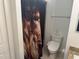 Clean bathroom with lion shower curtain and modern toilet at 341 N Fork Dr, Lakeland, FL 33809