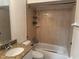 Clean bathroom with a bathtub, shower, and granite countertop vanity at 341 N Fork Dr, Lakeland, FL 33809