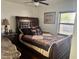 Cozy bedroom with a dark wood sleigh bed and patterned bedding at 341 N Fork Dr, Lakeland, FL 33809